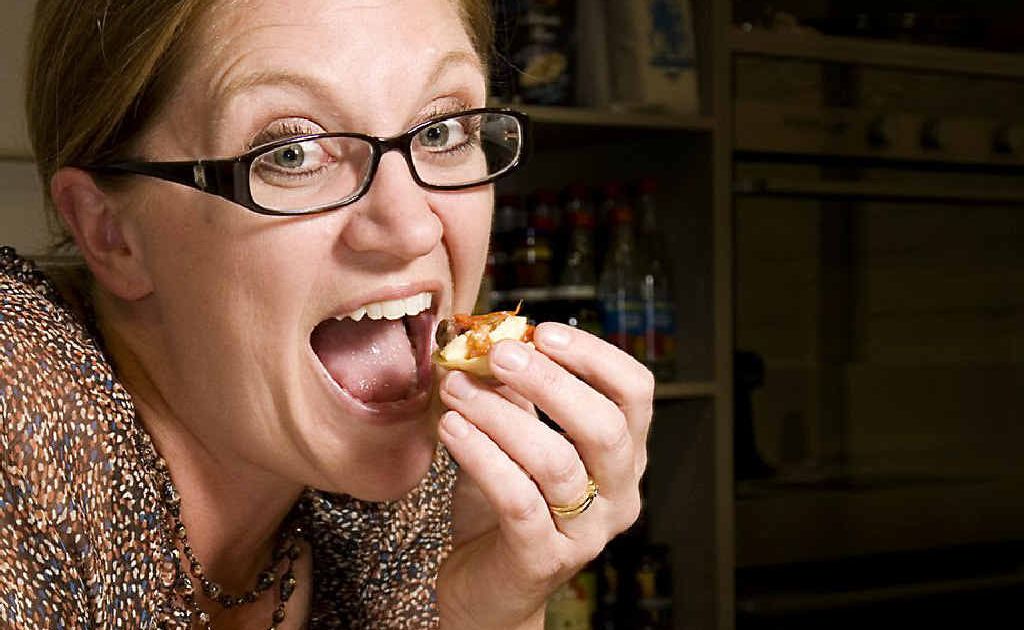 2011 Masterchef winner Kate Bracks samples a canape before giving a cooking demonstration in Toowoomba on Monday night. 